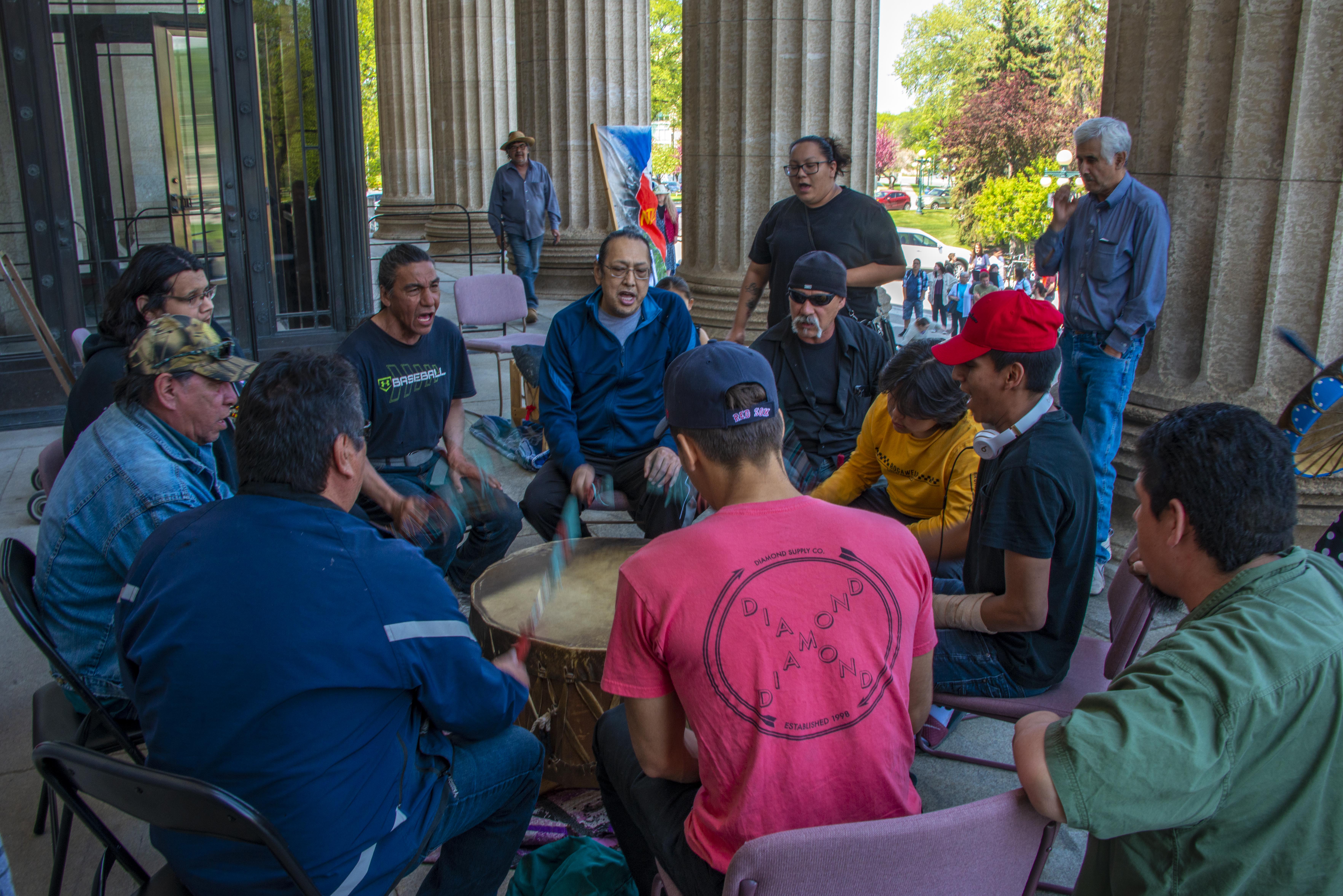 A drum group at the Manitoba Legislature protesting the the mine