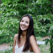 A woman smiling at the camera. End of image description.