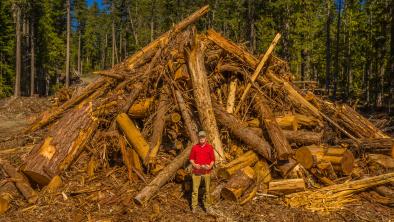 Joe Foy and logged Spotted Owl Critical Habitat. end of image description.