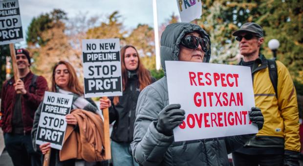 Gitxsan land defenders and supporters protest outside the B.C. legislature swearing in ceremony