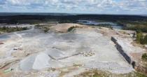 An aerial shot of a gravel mining berm. End of image description.